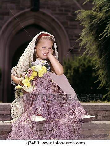 Stock Image - 1960s UNHAPPY LITTLE GIRL SITTING IN FRONT OF CHURCH JILTED LEFT WAITING AT THE ALTAR. Fotosearch