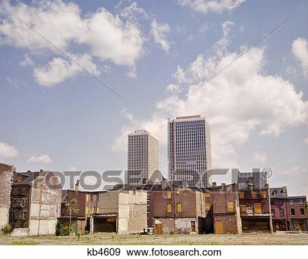 1960s URBAN RENEWAL RUN DOWN OLD HOUSES IN FOREGROUND NEW TALL APARTMENT BUILDINGS IN BACKGROUND View Large Photo Image Stock Photo - 1960s URBAN RENEWAL RUN DOWN OLD HOUSES IN FOREGROUND NEW TALL APARTMENT BUILDINGS IN BACKGROUND. Fotosearch