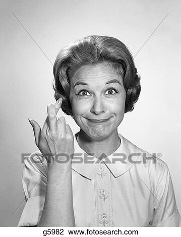 1960s WOMAN FUNNY FACIAL EXPRESSION WITH FINGERS CROSSED FOR LUCK LOOKING AT CAMERA View Large Photo Image Stock Image - 1960s WOMAN FUNNY FACIAL EXPRESSION WITH FINGERS CROSSED FOR LUCK LOOKING AT CAMERA. Fotosearch