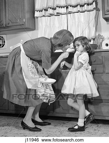 1960s WOMAN MOTHER IN KITCHEN DISCIPLINING GIRL HER DAUGHTER View Large Photo Image Stock Photograph - 1960s WOMAN MOTHER IN KITCHEN DISCIPLINING GIRL HER DAUGHTER. Fotosearch
