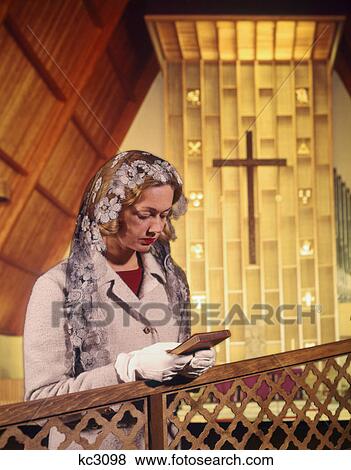 1960s WOMAN PRAYING IN CHURCH HOLDING BIBLE View Large Photo Image Stock Photo - 1960s WOMAN PRAYING IN CHURCH HOLDING BIBLE. Fotosearch