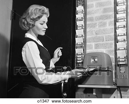 1960S Woman Punching Time Clock At Work View Large Photo Image Stock Photo - 1960S Woman Punching Time Clock At Work. Fotosearch