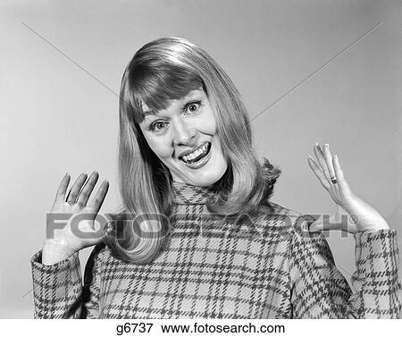 Stock Photo - 1960S Woman With Goofy Surprised Look On Face And Hands In The Air Smiling Looking At Camera. Fotosearch