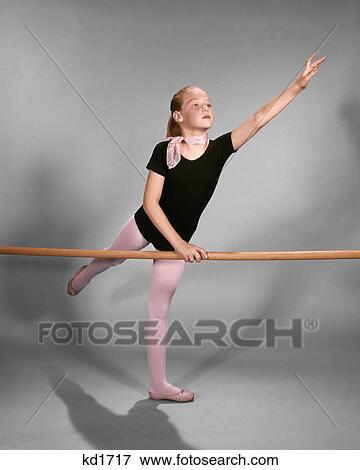 1960s YOUNG BLOND GIRL BALLET DANCER STRETCHING EXERCISING AT PRACTICE BALANCE BARRE View Large Photo Image Stock Photo - 1960s YOUNG BLOND GIRL BALLET DANCER STRETCHING EXERCISING AT PRACTICE BALANCE BARRE. Fotosearch
