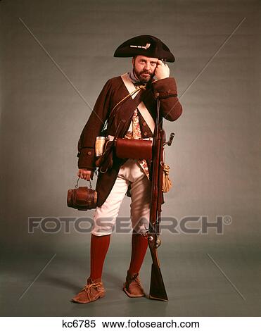 1970s 1776 AMERICAN REVOLUTION HISTORICAL REENACTOR MILITIA SOLDIER TRICORN HAT FLINTLOCK MUSKET AND BAYONET LOOKING AT CAMERA View Large Photo Image Stock Photography - 1970s 1776 AMERICAN REVOLUTION HISTORICAL REENACTOR MILITIA SOLDIER TRICORN HAT FLINTLOCK MUSKET AND BAYONET LOOKING AT CAMERA. Fotosearch