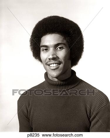 1970s 1975 SMILING AFRICAN AMERICAN MAN PORTRAIT WEARING TURTLENECK SWEATER AFRO HAIR STYLE LOOKING AT CAMERA View Large Photo Image Stock Photography - 1970s 1975 SMILING AFRICAN AMERICAN MAN PORTRAIT WEARING TURTLENECK SWEATER AFRO HAIR STYLE LOOKING AT CAMERA. Fotosearch