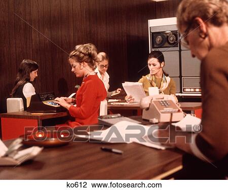 1970s 5 WOMEN OFFICE WORKERS DESKS COMPUTER MAINFRAME TELEPHONE PAPERS SECRETARY SECRETARIES WORK View Large Photo Image Stock Image - 1970s 5 WOMEN OFFICE WORKERS DESKS COMPUTER MAINFRAME TELEPHONE PAPERS SECRETARY SECRETARIES WORK. Fotosearch