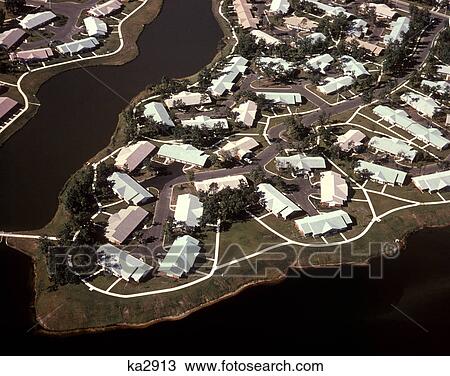 1970s AERIAL VIEW SUBURBAN HOMES BUILDINGS RIVER DEVELOPMENT HOUSING FLORIDA USA View Large Photo Image Stock Image - 1970s AERIAL VIEW SUBURBAN HOMES BUILDINGS RIVER DEVELOPMENT HOUSING FLORIDA USA. Fotosearch