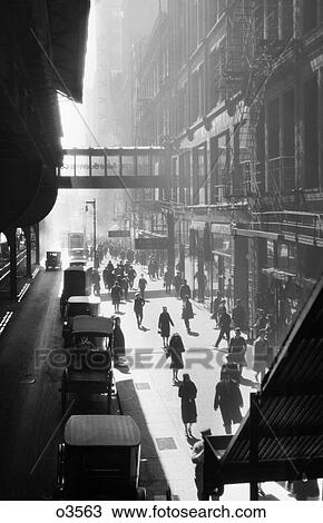 1970s ANONYMOUS SILHOUETTED PEDESTRIANS WALKING ON SIDEWALK WITH CARS PARKED ALONG CURB BENEATH ELEVATED TRAIN NEW YORK CITY USA View Large Photo Image Stock Image - 1970s ANONYMOUS SILHOUETTED PEDESTRIANS WALKING ON SIDEWALK WITH CARS PARKED ALONG CURB BENEATH ELEVATED TRAIN NEW YORK CITY USA. Fotosearch