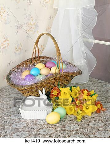 1970s BASKET FULL OF PASTEL DYED EASTER EGGS ON TABLE TOP BY WINDOW BOUQUET OF DAFFODILS MILK GLASS RABBIT DISH View Large Photo Image Stock Photo - 1970s BASKET FULL OF PASTEL DYED EASTER EGGS ON TABLE TOP BY WINDOW BOUQUET OF DAFFODILS MILK GLASS RABBIT DISH. Fotosearch