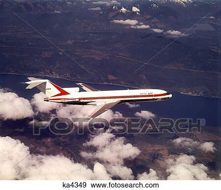 1970s BOEING 727 AIRPLANE PLANE FLYING TRANSPORTATION COMMERCIAL AVIATION AIR TRAVEL View Large Photo Image Stock Photo - 1970s BOEING 727 AIRPLANE PLANE FLYING TRANSPORTATION COMMERCIAL AVIATION AIR TRAVEL. Fotosearch