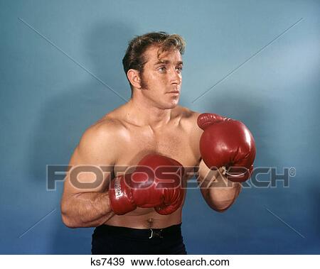 1970s BOXER PORTRAIT RED BOXING GLOVES SIDEBURNS View Large Photo Image Stock Photo - 1970s BOXER PORTRAIT RED BOXING GLOVES SIDEBURNS. Fotosearch
