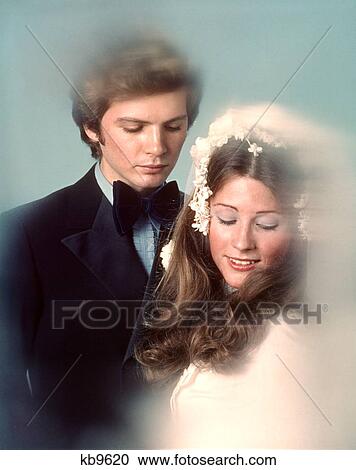 1970S Couple Bride Groom Portrait Looking Down View Large Photo Image Stock Image - 1970S Couple Bride Groom Portrait Looking Down. Fotosearch