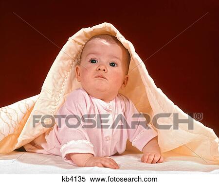 1970s CURIOUS BABY RAISING HEAD UNDER YELLOW BLANKET View Large Photo Image Stock Photography - 1970s CURIOUS BABY RAISING HEAD UNDER YELLOW BLANKET. Fotosearch