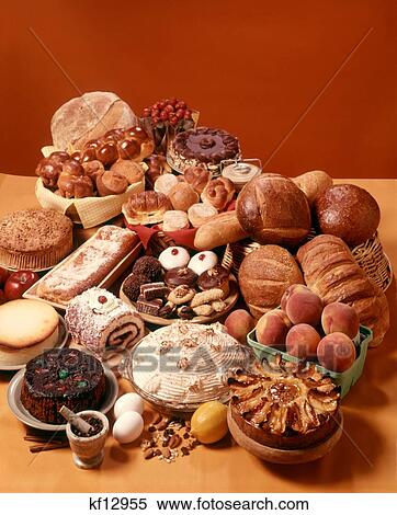 Stock Photography - 1970S Display Arrangement Pastry & Bread Items Ingredients Breads Pastries Cakes Cookies. Fotosearch