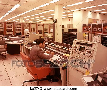 1970s LATINO MAN WORKING COMPUTER CONTROL BOARD COMPUTERS NASA SPACE EXPLORATION TEXAS USA View Large Photo Image Stock Image - 1970s LATINO MAN WORKING COMPUTER CONTROL BOARD COMPUTERS NASA SPACE EXPLORATION TEXAS USA. Fotosearch