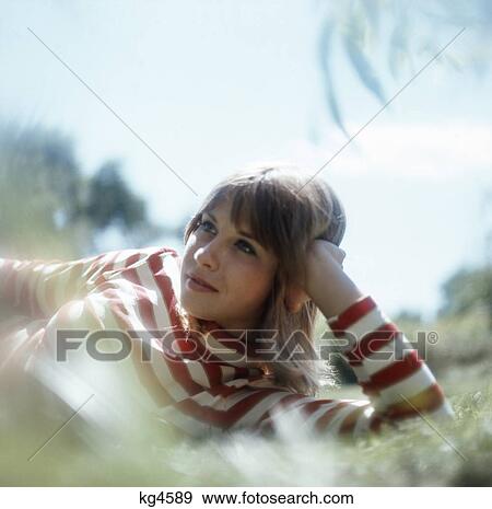 1970S Moody Portrait Young Teenage Woman Outdoors Head Leaning On Arm Thoughtful Expression View Large Photo Image Stock Photo - 1970S Moody Portrait Young Teenage Woman Outdoors Head Leaning On Arm Thoughtful Expression. Fotosearch