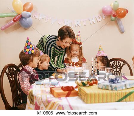 1970s MOTHER SERVING BIRTHDAY CAKE WITH CANDLES PRESENTS GIFTS CELEBRATION FOR FOUR CHILDREN View Large Photo Image Stock Photography - 1970s MOTHER SERVING BIRTHDAY CAKE WITH CANDLES PRESENTS GIFTS CELEBRATION FOR FOUR CHILDREN. Fotosearch