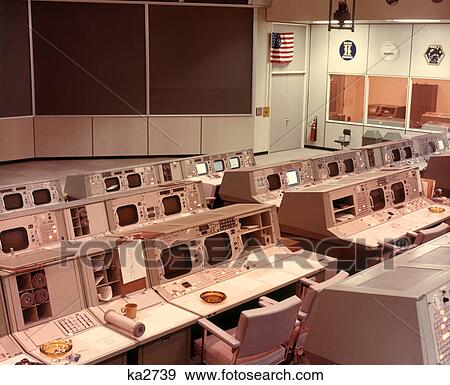 1970s NASA EMPTY COMPUTER ROOM CONTROLS AND MONITORS FOR SPACE EXPLORATION AND COMMUNICATIONS TEXAS USA View Large Photo Image Stock Photo - 1970s NASA EMPTY COMPUTER ROOM CONTROLS AND MONITORS FOR SPACE EXPLORATION AND COMMUNICATIONS TEXAS USA. Fotosearch