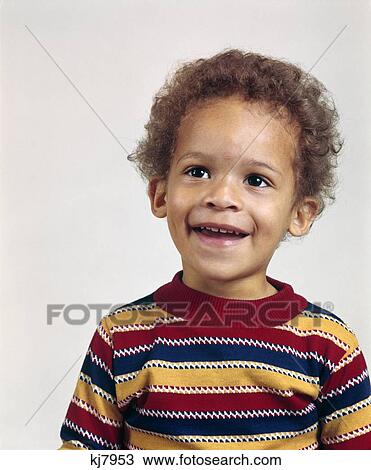1970s PORTRAIT SMILING AFRICAN AMERICAN TODDLER BOY WEARING STRIPED T-SHIRT View Large Photo Image Stock Image - 1970s PORTRAIT SMILING AFRICAN AMERICAN TODDLER BOY WEARING STRIPED T-SHIRT. Fotosearch