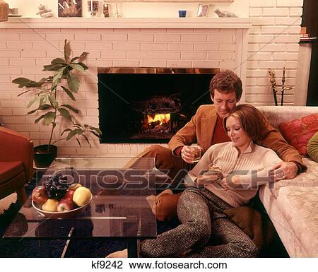 1970S Romantic Couple Man And Woman Having Drinks By Fireplace Sitting On Floor View Large Photo Image Stock Image - 1970S Romantic Couple Man And Woman Having Drinks By Fireplace Sitting On Floor. Fotosearch