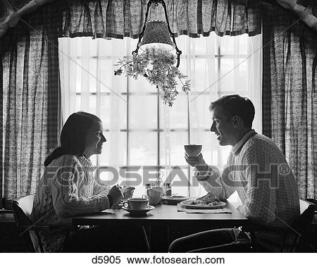 1970S Silhouetted Couple Eating At Table By Window View Large Photo Image Stock Photography - 1970S Silhouetted Couple Eating At Table By Window. Fotosearch