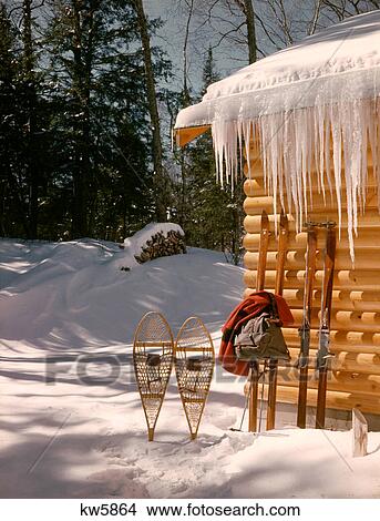 1970s SNOW SNOWSHOES TWO PAIR SKIS JACKET BACKPACK LEANING AGAINST WALL LOG CABIN SKI LODGE MOUNTAIN RETREAT View Large Photo Image Picture - 1970s SNOW SNOWSHOES TWO PAIR SKIS JACKET BACKPACK LEANING AGAINST WALL LOG CABIN SKI LODGE MOUNTAIN RETREAT. Fotosearch