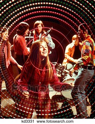 1970S Teenage Rock Band Group And Boys And Girls Disco Dancing Amid Swirling Psychedelic Lights And Music View Large Photo Image Stock Image - 1970S Teenage Rock Band Group And Boys And Girls Disco Dancing Amid Swirling Psychedelic Lights And Music. Fotosearch