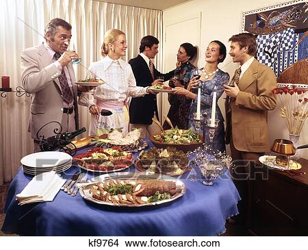 Picture - 1970S Three Couples Men And Women At Buffet Dinner Party Eating Drinking Talking Laughing Having A Good Time. Fotosearch