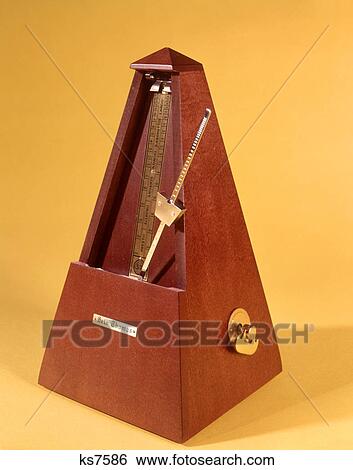 1970s WOODEN METRONOME KEEPING TIME View Large Photo Image Stock Photograph - 1970s WOODEN METRONOME KEEPING TIME. Fotosearch