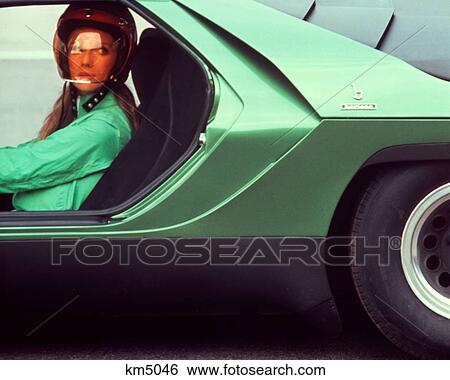 1970S Young Woman Wear Helmet Green Shirt Driving Green Italian Sports Sport Race Racing Car Jet Set View Large Photo Image Stock Photograph - 1970S Young Woman Wear Helmet Green Shirt Driving Green Italian Sports Sport Race Racing Car Jet Set. Fotosearch