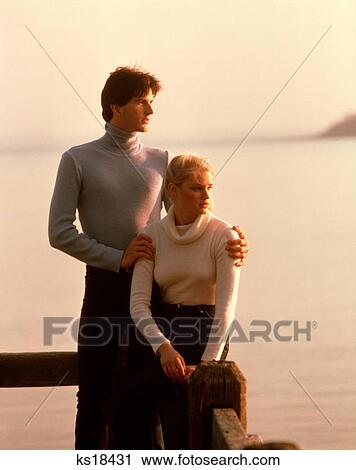 1980s 1970s PORTRAIT COUPLE TURTLENECK SWEATERS DOCK LAKE MAN WOMAN MOODY ROMANCE COUPLES MEN WOMEN View Large Photo Image Stock Image - 1980s 1970s PORTRAIT COUPLE TURTLENECK SWEATERS DOCK LAKE MAN WOMAN MOODY ROMANCE COUPLES MEN WOMEN. Fotosearch