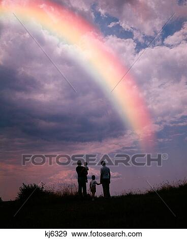 1980S Anonymous Silhouetted Family Looking At Rainbow View Large Photo Image Stock Photo - 1980S Anonymous Silhouetted Family Looking At Rainbow . Fotosearch