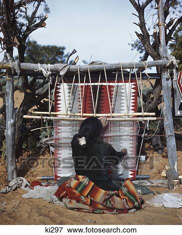 1980s NAVAJO INDIAN WOMAN WEAVING BLANKET WITH TRADITIONAL DESIGN SOUTHWEST USA View Large Photo Image Stock Photo - 1980s NAVAJO INDIAN WOMAN WEAVING BLANKET WITH TRADITIONAL DESIGN SOUTHWEST USA. Fotosearch