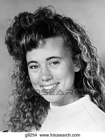 1980S Portrait Smiling Teenage Girl With Big Hair Fashion Hairstyle Looking At Camera View Large Photo Image Picture - 1980S Portrait Smiling Teenage Girl With Big Hair Fashion Hairstyle Looking At Camera. Fotosearch