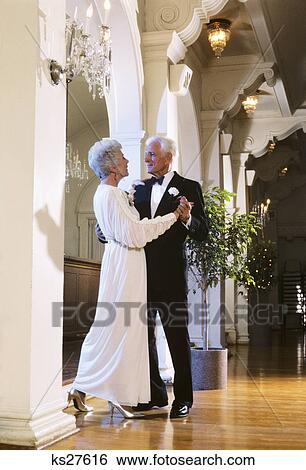 1980s SENIOR COUPLE DANCING WOMAN IN EVENING DRESS AND MAN WEARING TUXEDO View Large Photo Image Stock Photograph - 1980s SENIOR COUPLE DANCING WOMAN IN EVENING DRESS AND MAN WEARING TUXEDO. Fotosearch