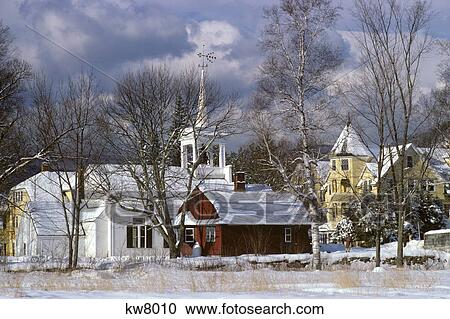 Stock Image - 1980s WINTER SNOW SCENE VILLAGE CHURCH AND HOUSES JACKSON NEW HAMPSHIRE USA. Fotosearch