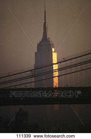 1990S Empire State Building And Manhattan Bridge Reflecting Early Morning Sunrise New York City Usa View Large Photo Image Stock Photo - 1990S Empire State Building And Manhattan Bridge Reflecting Early Morning Sunrise New York City Usa. Fotosearch
