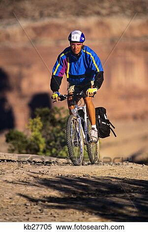 1990s YOUNG MAN RIDING BICYCLE MOAB UTAH USA View Large Photo Image Stock Photography - 1990s YOUNG MAN RIDING BICYCLE MOAB UTAH USA. Fotosearch