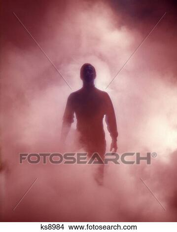 ANONYMOUS MAN SILHOUETTED IN SMOKY FOG MENACING MOOD View Large Photo Image Picture - ANONYMOUS MAN SILHOUETTED IN SMOKY FOG MENACING MOOD. Fotosearch