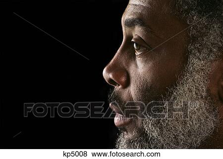 CLOSE-UP PROFILE PORTRAIT OF SERIOUS AFRICAN AMERICAN MAN WITH A BEARD View Large Photo Image Stock Photo - CLOSE-UP PROFILE PORTRAIT OF SERIOUS AFRICAN AMERICAN MAN WITH A BEARD. Fotosearch