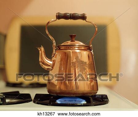 COPPER TEA KETTLE ON GAS FLAME View Large Photo Image Stock Photo - COPPER TEA KETTLE ON GAS FLAME. Fotosearch