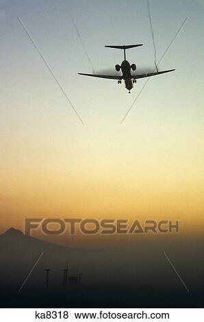 Dc-9 Landing In Ground Fog Rear View Vapor Trail View Large Photo Image Stock Photo - Dc-9 Landing In Ground Fog Rear View Vapor Trail. Fotosearch