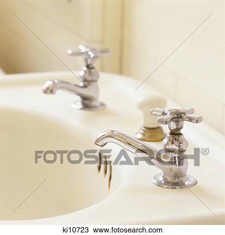 DETAIL OF 1930s 1940s STYLE ANTIQUE WHITE PORCELAIN SINK WITH NICKEL PLATED FAUCETS View Large Photo Image Stock Image - DETAIL OF 1930s 1940s STYLE ANTIQUE WHITE PORCELAIN SINK WITH NICKEL PLATED FAUCETS. Fotosearch