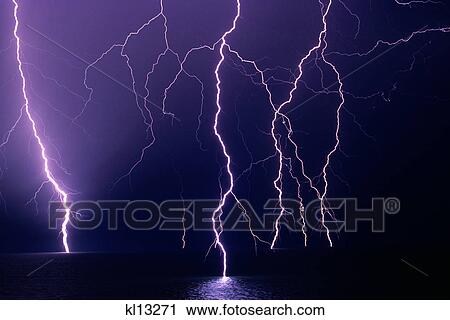 MULTIPLE LIGHTNING STRIKES ON LAND AND WATER DURING POWERFUL THUNDER STORM View Large Photo Image Stock Image - MULTIPLE LIGHTNING STRIKES ON LAND AND WATER DURING POWERFUL THUNDER STORM. Fotosearch