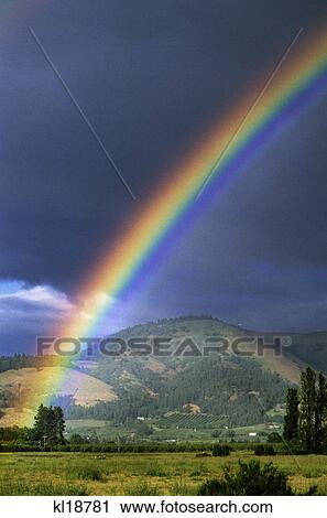 RAINBOW AGAINST DARK STORM CLOUDS HOOD RIVER VALLEY OREGON USA View Large Photo Image Stock Image - RAINBOW AGAINST DARK STORM CLOUDS HOOD RIVER VALLEY OREGON USA. Fotosearch