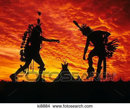 Sunrise Or Sunset Silhouette Of Two Native American Indian Men Dancing At Pow Wow With Tepees In Background View Large Photo Image Picture - Sunrise Or Sunset Silhouette Of Two Native American Indian Men Dancing At Pow Wow With Tepees In Background . Fotosearch