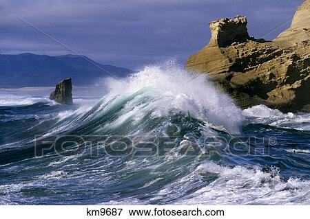 Stock Photo - WAVES CRASHING ONTO ROCKS CAPE KIWANDA OREGON USA. Fotosearch