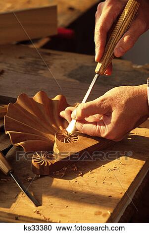 WOODCARVER'S HANDS AND CARVING A DECORATIVE CLAM SHELL View Large Photo Image Stock Image - WOODCARVER'S HANDS AND CARVING A DECORATIVE CLAM SHELL. Fotosearch