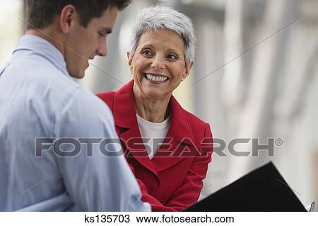 Stock Photo - Businesswoman with intern. Fotosearch - Search Stock Images, Poster Photographs, Pictures, and Clip Art Photos